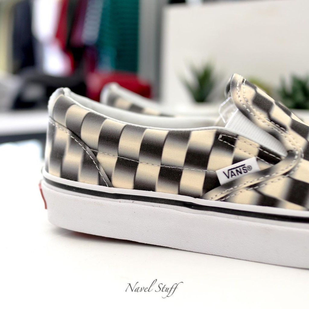 Blurred checkerboard vans slip on hotsell