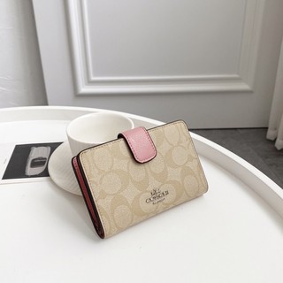 Shop Coach Medium Corner Zip Wallet In Signature Canvas (F23553) by  ペガサスペガサス☆