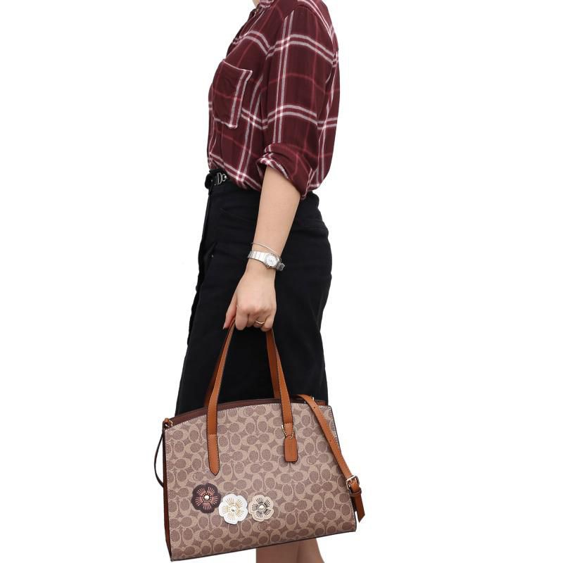 Coach charlie carryall online 35