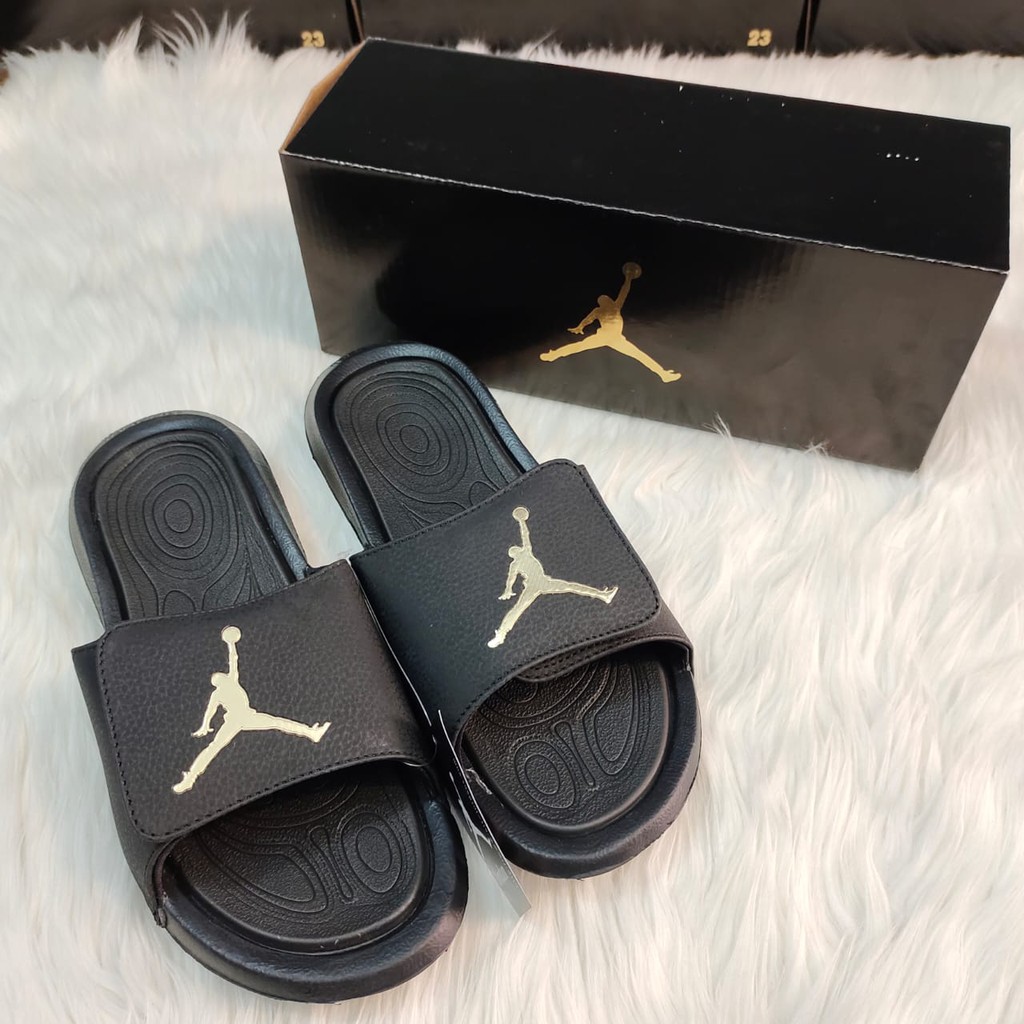 Jordan slippers best sale black and gold