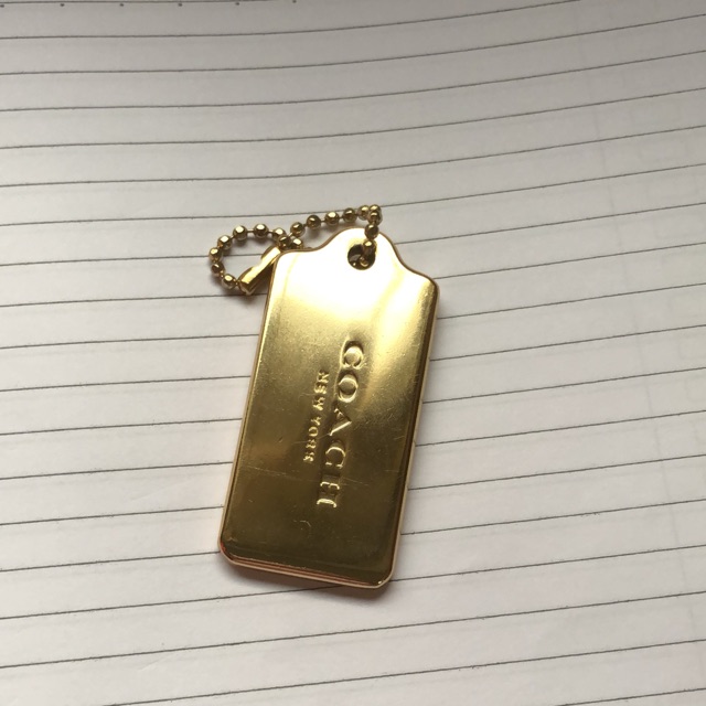 Coach gold metal hang tag new arrivals