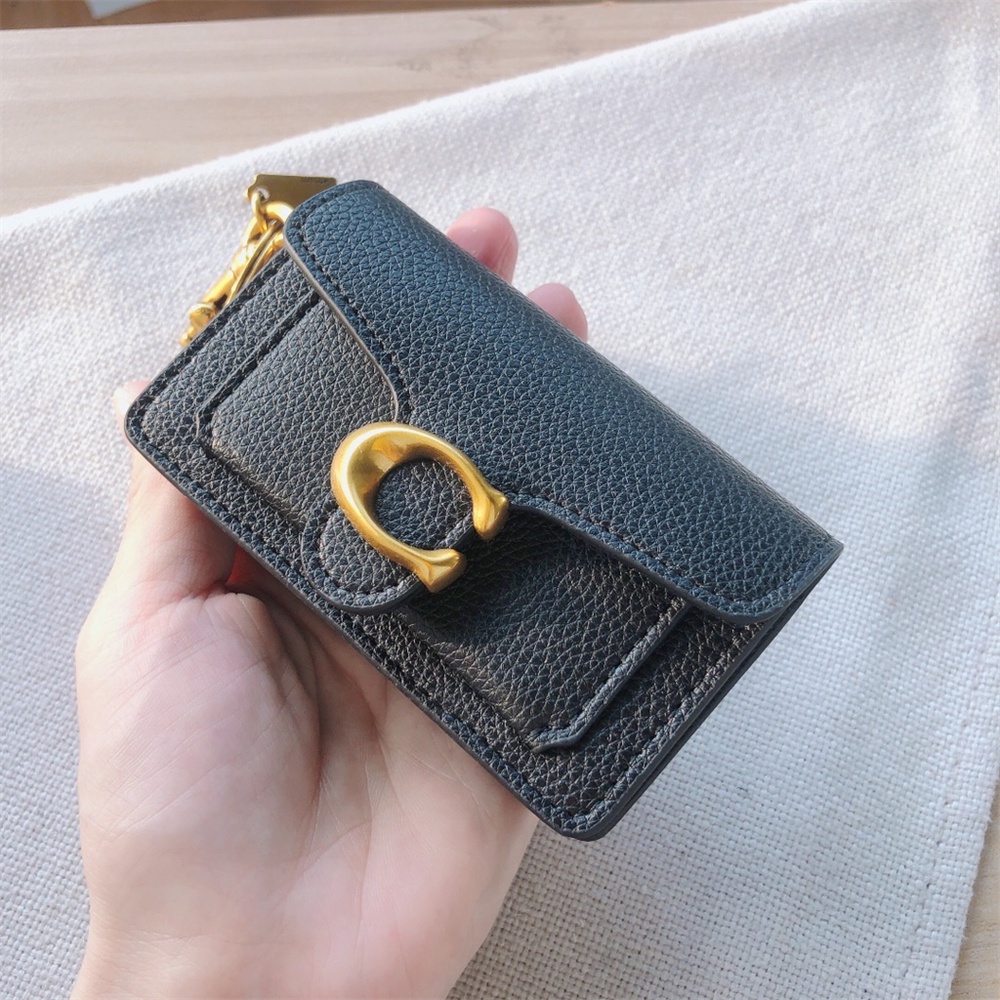Mini tabby bag charm in signature canvas hotsell