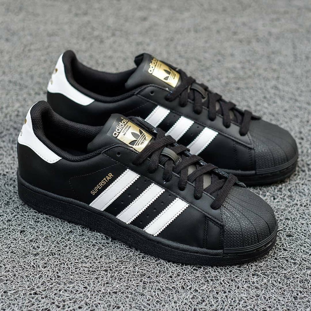 Adidas superstar black on sale and white harga