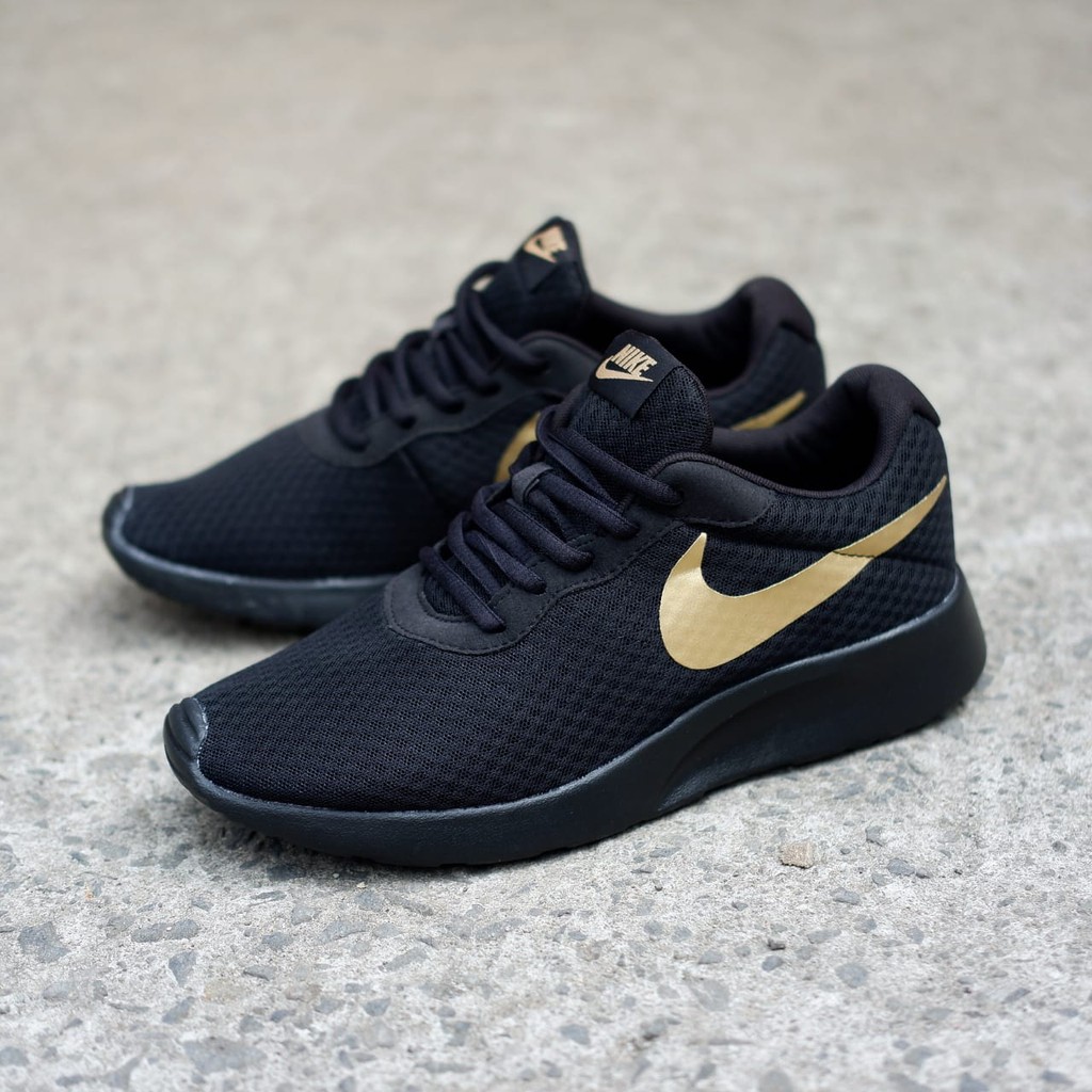 Nike tanjun cheap black gold original