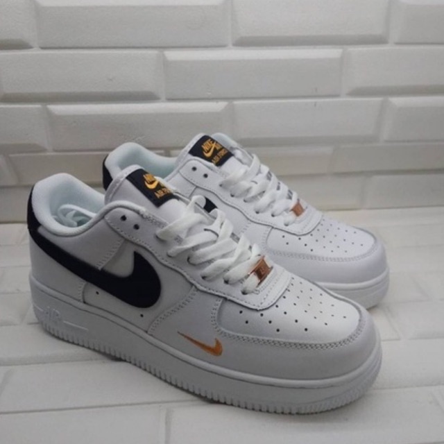 black white gold air force ones