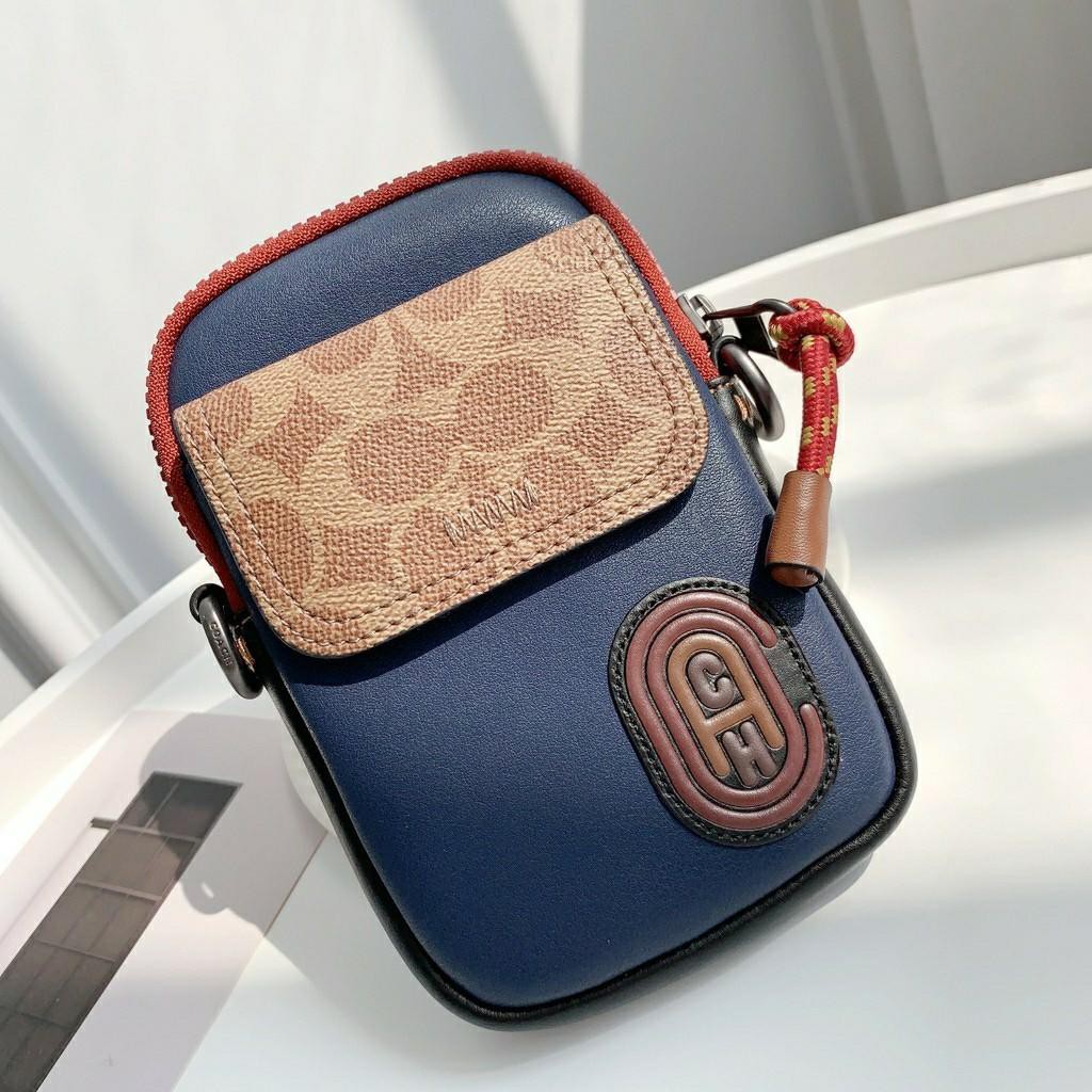 COACH PACER CONVERTIBLE POUCH IN COLORBLOCK SIGNATURE CANVAS