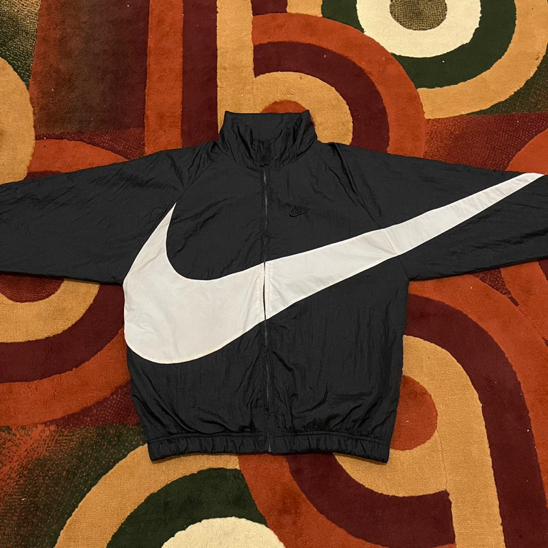 Nike big swoosh on sale black