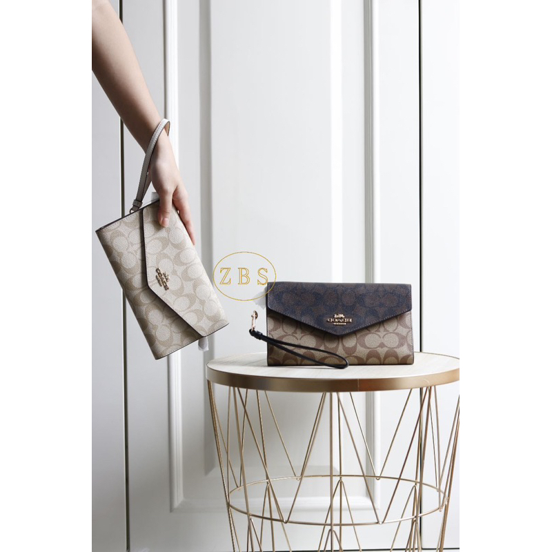 Jual Coach Travel Envelope Wallet In Blocked Signature Canvas Shopee