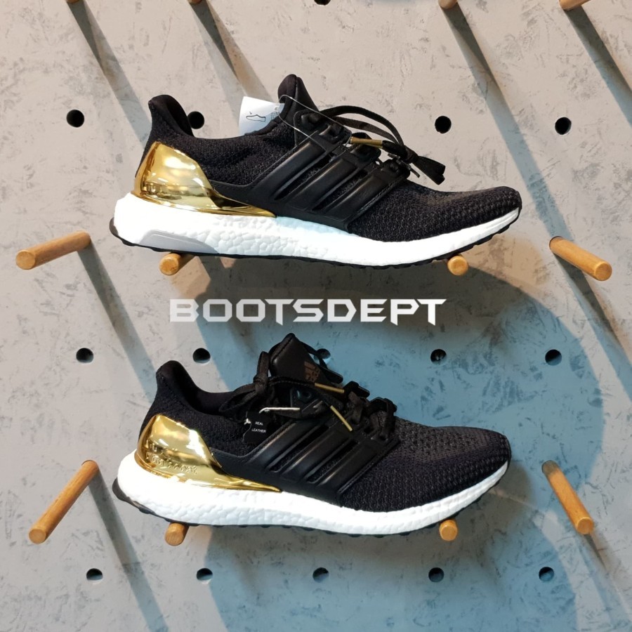 Ultra boost 2024 gold medal fake