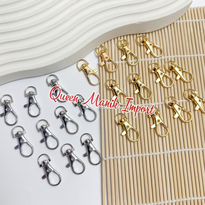 A sturdy metal shrimp hook fastener, representing the strong linking elements in the Wrexham ownership structure