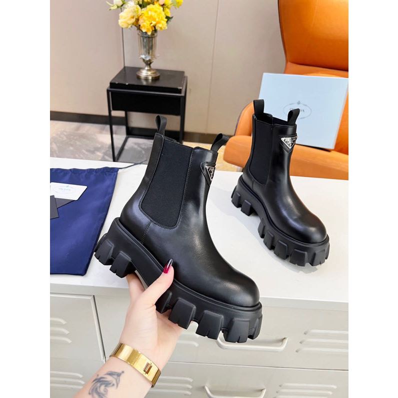 Prada daugher women s boots black