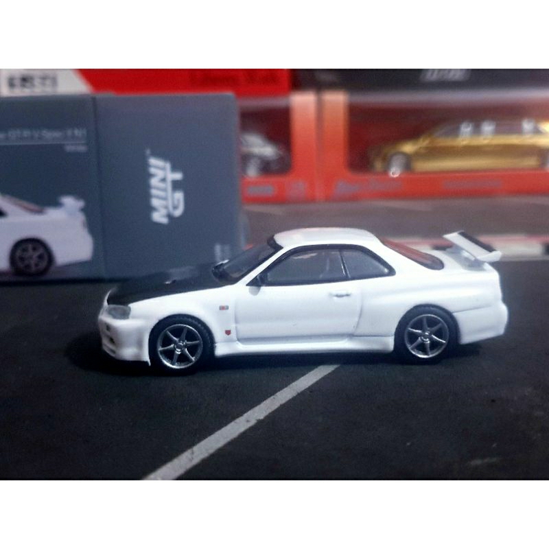Mini Gt Nissan Gt-r (R34) V-spec Active Rosso #796 1/64 Inseguimento