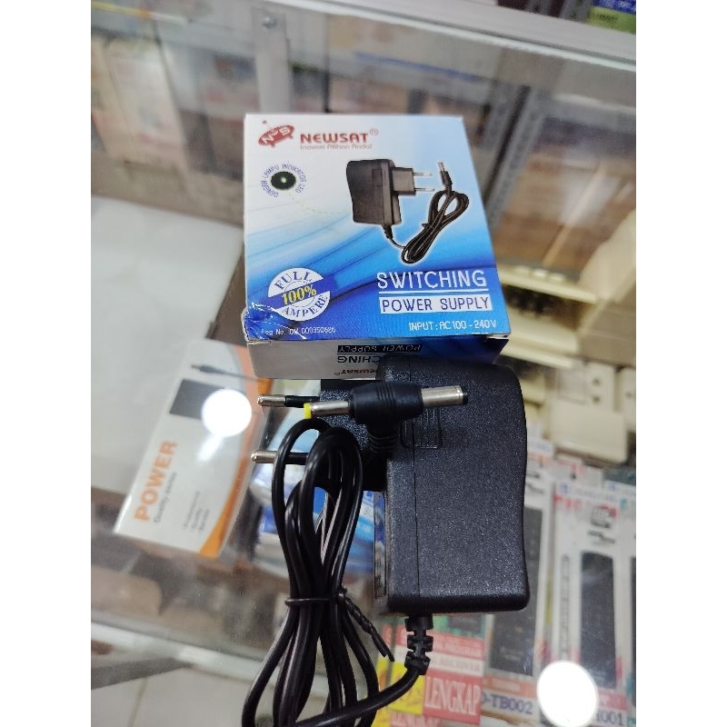 Jual ADAPTOR POWER SUPPLY SWITCHING CCTV ROUTER 1AMPERE NEWSAT SNI ...