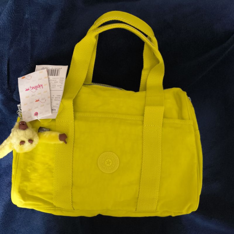 Jual tas kip*ling warna kuning new with strap | Shopee Indonesia