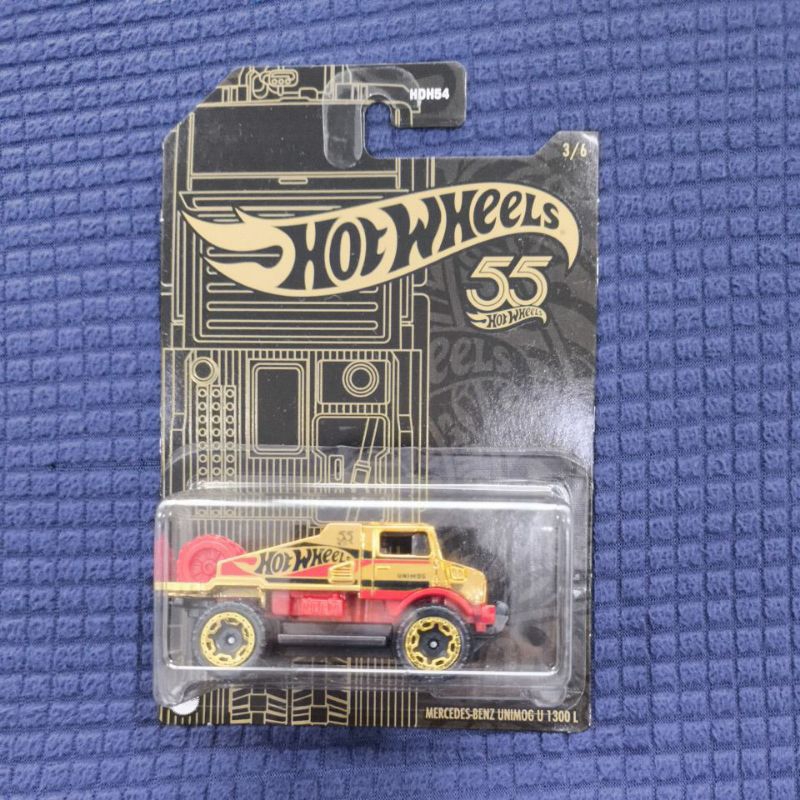 Hot Wheels - Mercedes-Benz UNIMOG 1300 - HW Haulers 4/5 - Marrón - 2023 - Mint/NrMint envía burbujas envueltas en una caja