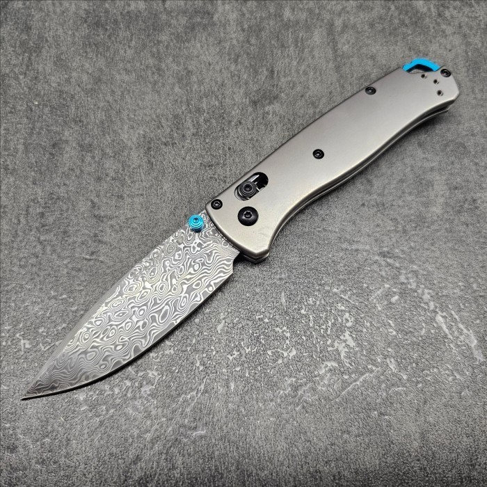 thumbnail image 2 of Benchmade 535 Bugout Custom Anodized Green Titanium Thumb Stud Set 2 of 4