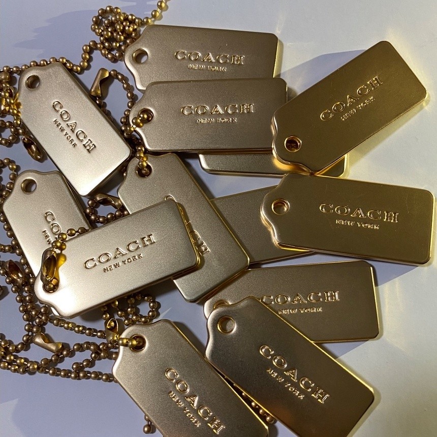 Coach gold metal hang tag sales